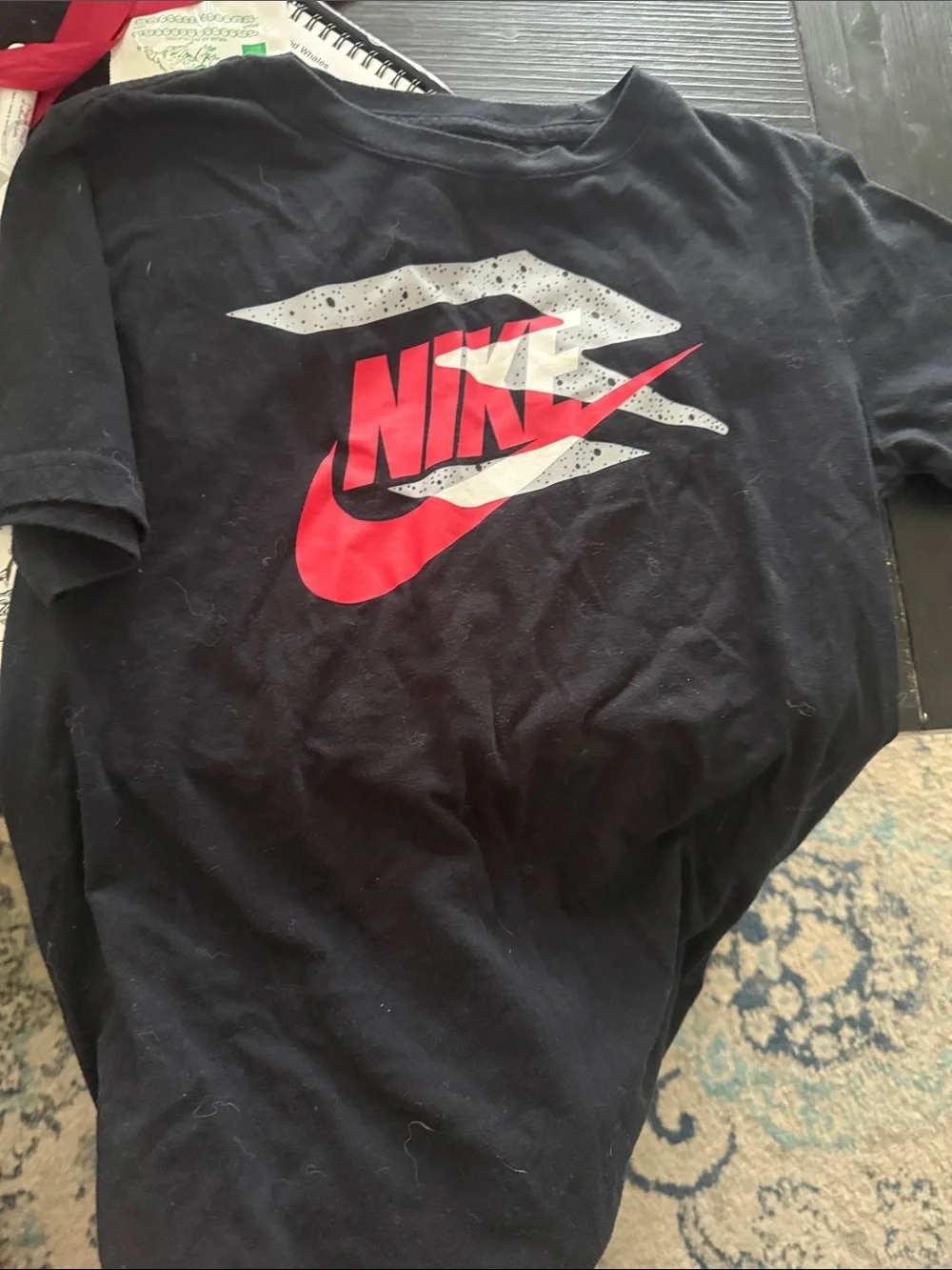 Nike Black Tee with Red Swoosh and White Speckle Graphic